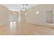 Expansive living room with hardwood floors, recessed lighting, ceiling fan and neutral walls at 5309 Spectacular Bid Dr, Wesley Chapel, FL 33544