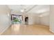 Spacious living room with hardwood floors, neutral walls, and large windows offering ample natural light at 5309 Spectacular Bid Dr, Wesley Chapel, FL 33544