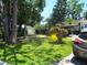 Scenic front yard with mature trees and a lush green lawn at 5468 26Th N Ave, St Petersburg, FL 33710