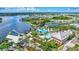 A beautiful waterfront community with multiple docks, a swimming pool, and mature trees at 5518 Luminar Pointe Ln, Apollo Beach, FL 33572
