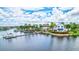 Community waterfront recreation area with beautiful buildings, a dock, a playground, and lush landscaping at 5518 Luminar Pointe Ln, Apollo Beach, FL 33572