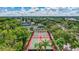 Aerial view of several community basketball courts surrounded by lush landscaping, offering a great recreational amenity at 5518 Luminar Pointe Ln, Apollo Beach, FL 33572