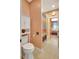 Bathroom with tile flooring, colorful shower curtain, and white wooden cabinet at 5518 Luminar Pointe Ln, Apollo Beach, FL 33572