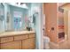 Bright bathroom featuring a vanity with a framed mirror and a separate toilet and shower area at 5518 Luminar Pointe Ln, Apollo Beach, FL 33572