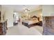 Bedroom showcasing a large bed, dressers, and a view into the bathroom at 5518 Luminar Pointe Ln, Apollo Beach, FL 33572