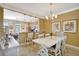 Bright dining area featuring a breakfast bar and chandelier lighting at 5518 Luminar Pointe Ln, Apollo Beach, FL 33572