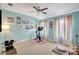 Bright exercise room with vaulted ceilings, ample natural light, and space for a Peloton bike at 5518 Luminar Pointe Ln, Apollo Beach, FL 33572