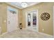 Charming foyer featuring decorative accents, marble floors, and access to an office at 5518 Luminar Pointe Ln, Apollo Beach, FL 33572