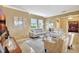 Inviting living room showcases modern decor, abundant natural light, and plush seating arrangement at 5518 Luminar Pointe Ln, Apollo Beach, FL 33572