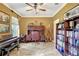 Spacious home office with custom built-ins, ample lighting, and neutral paint at 5518 Luminar Pointe Ln, Apollo Beach, FL 33572