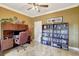 Functional office space featuring custom built-in shelving, workspace, and ample storage at 5518 Luminar Pointe Ln, Apollo Beach, FL 33572