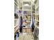 Functional walk-in closet provides ample storage with shelves and hanging rods at 5518 Luminar Pointe Ln, Apollo Beach, FL 33572