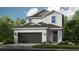 Charming two-story home with a gray roof, a two-car garage, and well-maintained landscaping at 719 Steel Dr, Apollo Beach, FL 33572