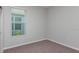 Clean bedroom with neutral carpet and a window for natural light at 720 Sky Shade Dr, Apollo Beach, FL 33572
