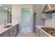Modern kitchen with stainless steel appliances, gas range and sleek white countertops at 720 Sky Shade Dr, Apollo Beach, FL 33572
