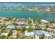 Expansive aerial view showcasing the desirable waterfront homes and neighborhood with beautiful water views at 759 Lantana Ave, Clearwater Beach, FL 33767