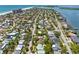 Breathtaking aerial view displaying a coastal community, with tree-lined streets and a glimpse of the beach at 759 Lantana Ave, Clearwater Beach, FL 33767