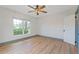 Bedroom featuring wood floors and a bright window at 759 Lantana Ave, Clearwater Beach, FL 33767