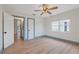 Bedroom with wood floors, bright windows, and en-suite bathroom at 759 Lantana Ave, Clearwater Beach, FL 33767