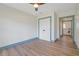 Bedroom featuring sleek ceiling fan, closet, wood flooring and easy access to bathroom at 759 Lantana Ave, Clearwater Beach, FL 33767