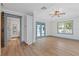 Spacious bedroom featuring wood floors, double doors to back yard, and en-suite bathroom at 759 Lantana Ave, Clearwater Beach, FL 33767