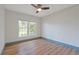 Bright bedroom featuring a large window for natural light and wood flooring at 759 Lantana Ave, Clearwater Beach, FL 33767