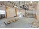 Expansive garage space with high ceilings, a roll-up door, and versatile layout, offering ample storage and workspace at 759 Lantana Ave, Clearwater Beach, FL 33767