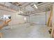 Spacious garage with high ceilings, ample storage, and a large roll-up door at 759 Lantana Ave, Clearwater Beach, FL 33767