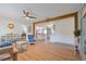 Open floor plan with hardwood floors, white walls, and a structural beam, creating a bright and airy living space at 759 Lantana Ave, Clearwater Beach, FL 33767