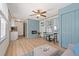 Open concept living area featuring a modern fireplace and a dining space at 759 Lantana Ave, Clearwater Beach, FL 33767