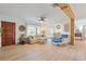Comfortable living room with hardwood floors, a wood beam, and a cozy seating arrangement, exuding a relaxed ambiance at 759 Lantana Ave, Clearwater Beach, FL 33767