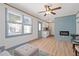 Living area featuring natural light, modern fireplace, and access to a kitchenette at 759 Lantana Ave, Clearwater Beach, FL 33767
