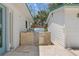 Stylish outdoor kitchen featuring a built-in grill, granite countertops, and ample storage space at 759 Lantana Ave, Clearwater Beach, FL 33767