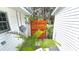Private outdoor shower with a wooden privacy screen, offering a refreshing experience amidst lush greenery at 759 Lantana Ave, Clearwater Beach, FL 33767