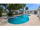 Breathtaking aerial view of the sparkling pool and spa, surrounded by manicured landscaping and charming architecture at 759 Lantana Ave, Clearwater Beach, FL 33767
