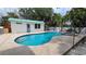 Inviting pool and spa area surrounded by lush landscaping and a charming pool house, perfect for relaxation at 759 Lantana Ave, Clearwater Beach, FL 33767