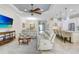Spacious living room with sofa seating and adjacent eat-in kitchen area at 8605 Grand Alberato Rd, Tampa, FL 33647