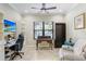 Comfortable office space with built-in shelving, desk, and relaxing recliner at 8605 Grand Alberato Rd, Tampa, FL 33647
