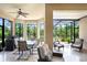 Spacious outdoor patio with dining and lounging areas, perfect for enjoying the beautiful surroundings at 8605 Grand Alberato Rd, Tampa, FL 33647