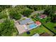 An aerial view highlights the property's fenced yard with sheds, pool, and neighborhood location at 915 S Miller Rd, Valrico, FL 33594