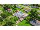 Aerial view showcasing the pool, sheds, and layout of the property and its fenced backyard at 915 S Miller Rd, Valrico, FL 33594
