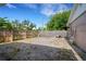 Gravel backyard with wood fence, offering a spacious and private outdoor area at 915 S Miller Rd, Valrico, FL 33594