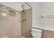 Bathroom featuring shower with tiled walls, adding a modern touch to this functional space at 915 S Miller Rd, Valrico, FL 33594