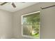 Bedroom showcasing a bright window and neutral colored walls at 915 S Miller Rd, Valrico, FL 33594