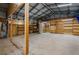 Large garage featuring ample space, plywood walls and an overhead metal structure at 915 S Miller Rd, Valrico, FL 33594