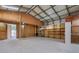 Large garage space with shelving, offering ample storage and workspace opportunities at 915 S Miller Rd, Valrico, FL 33594