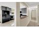 The kitchen offers sleek gray cabinets, black appliances, and bright lighting with a decorative backsplash at 915 S Miller Rd, Valrico, FL 33594