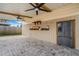 The outdoor kitchen features a refrigerator, ceiling fans and exposed wood beams at 915 S Miller Rd, Valrico, FL 33594