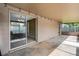 A spacious covered patio with sliding glass doors and concrete floors offers additional outdoor space at 915 S Miller Rd, Valrico, FL 33594