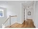 Bright hallway with hardwood floors and white trim leading to bedrooms and closets at 101 E Lambright St, Tampa, FL 33604